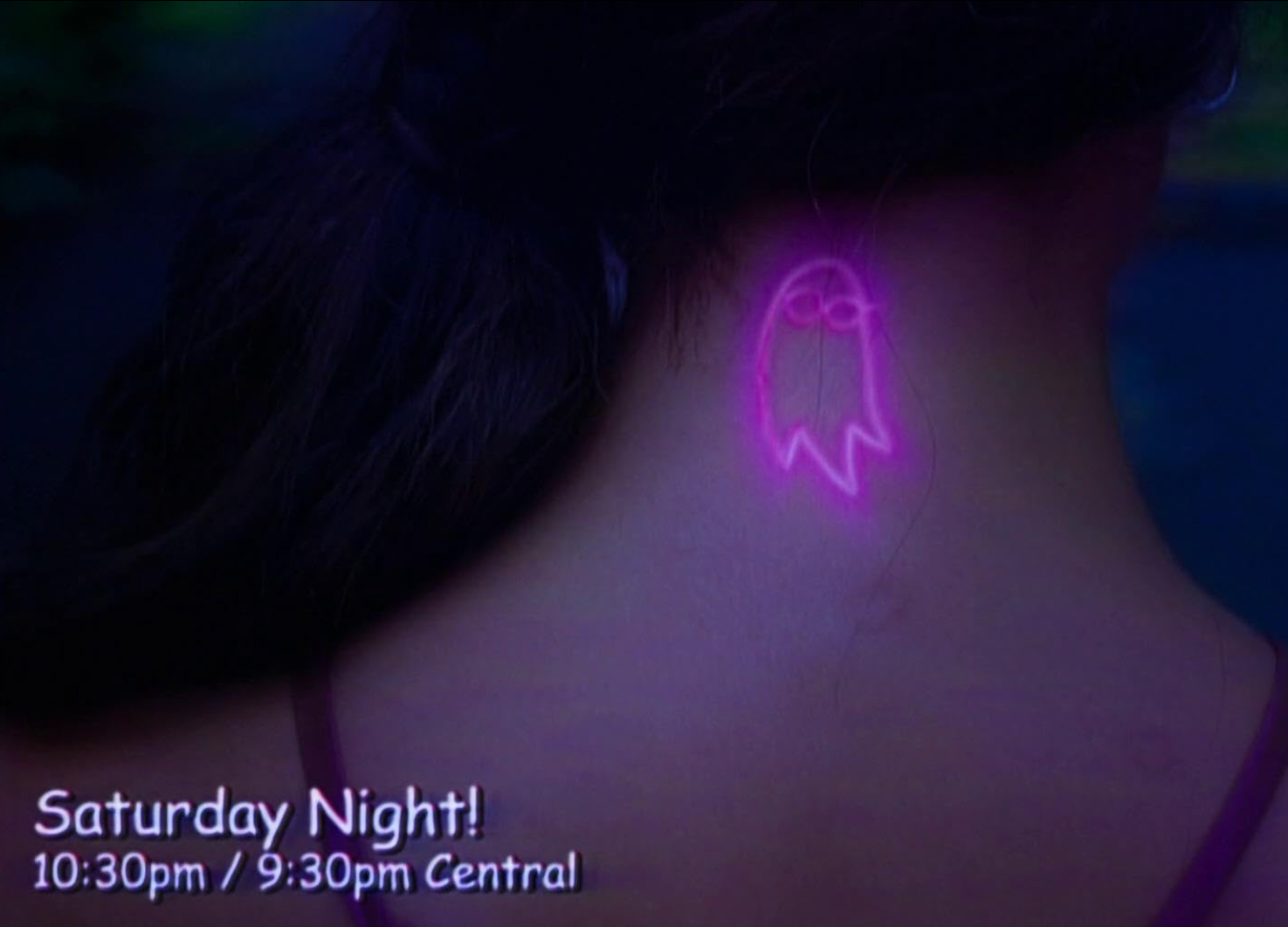 A pink tattoo of a ghost on the back of someones neck. Styled like a screen cap from a 90s show